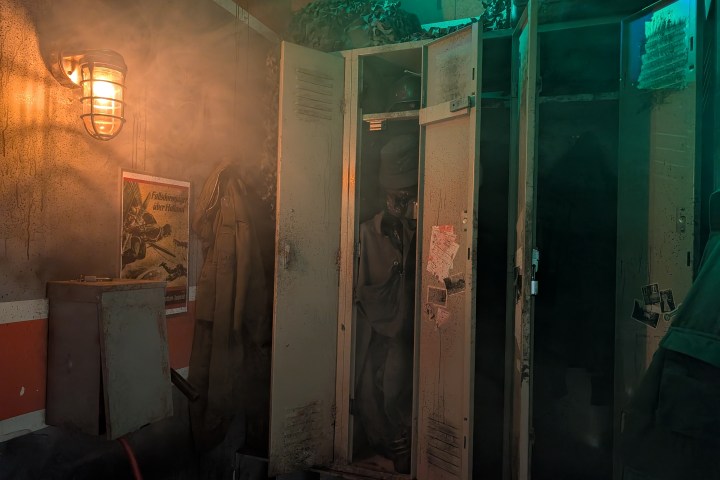 Dimly lit locker room with open lockers and warm light.
